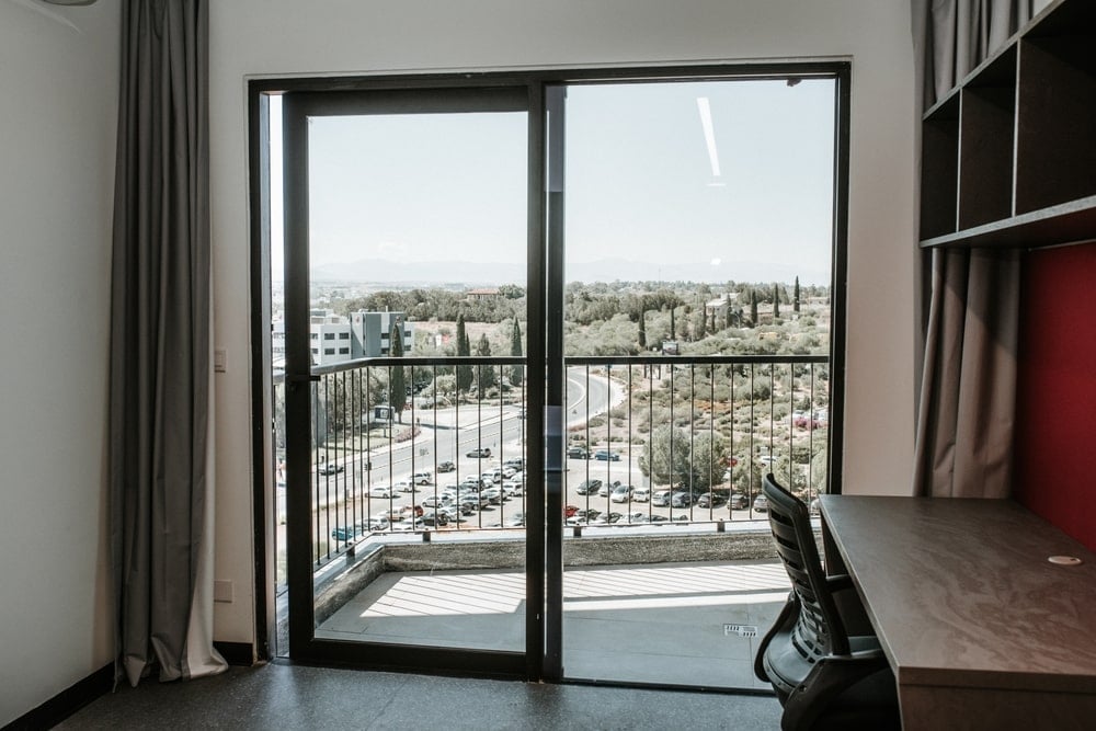Room balcony with view to the parking and the park