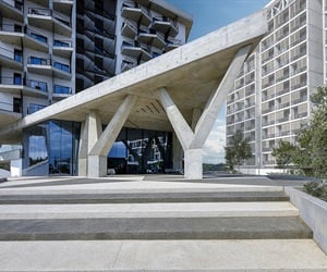 Entrance of the building with a large triangle made of concrete