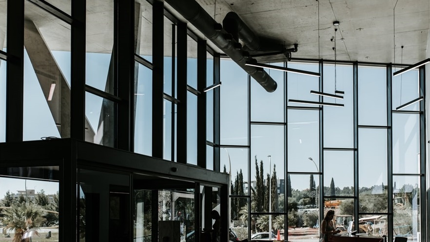 The lobby with high ceiling and glass façade