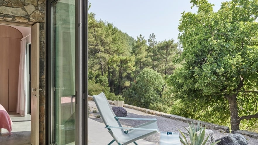 Open aluminum window with terrace and forest view