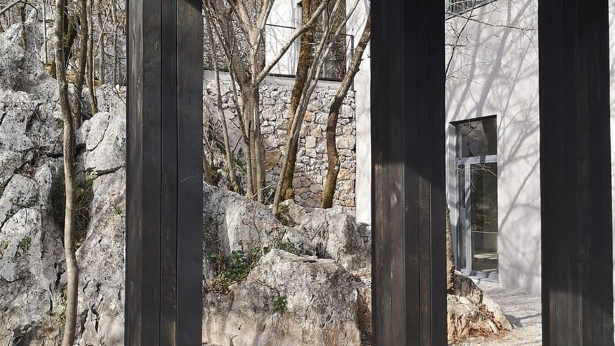 The terrace views to large rocks and trees
