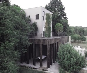 The villa is surrounded by trees