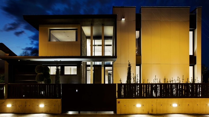 Façade of the house with light on