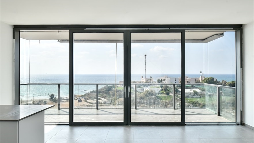 Closed aluminum windows with a view to the sea