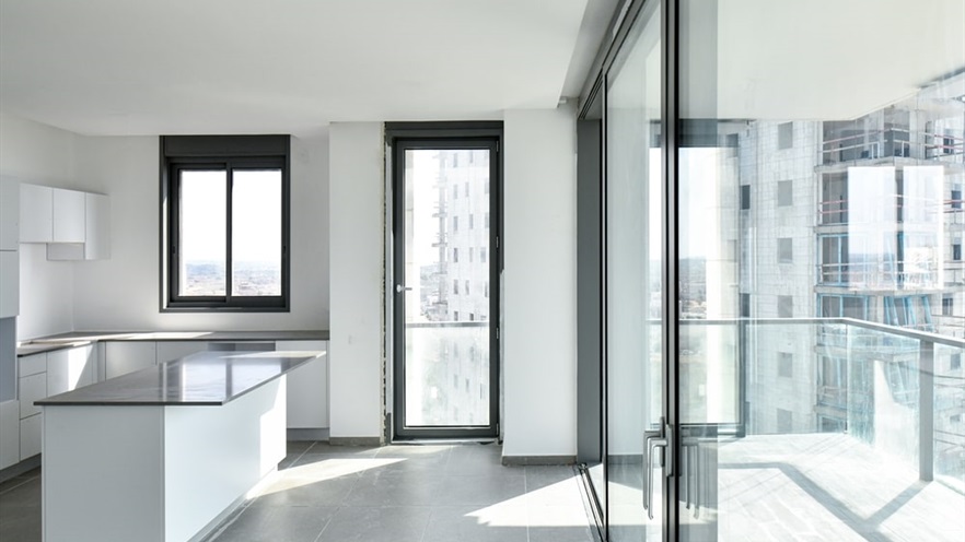White kitchen with large openings