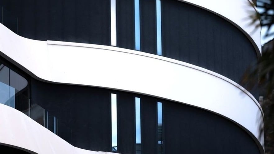 The building has curves and black & white lines