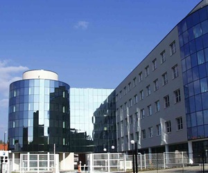 The building is covered with cladding and curtain wall