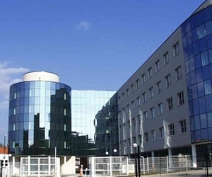 The building is covered with cladding and curtain wall