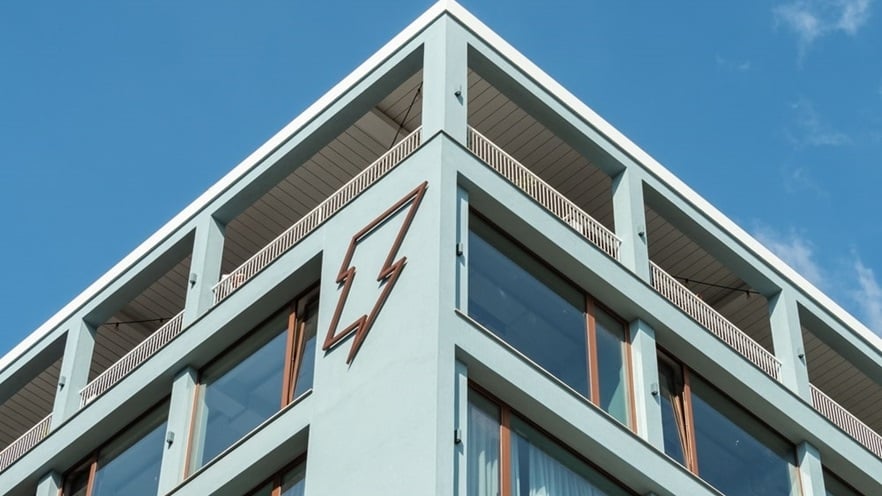 The hostel's logo is a thunderbolt