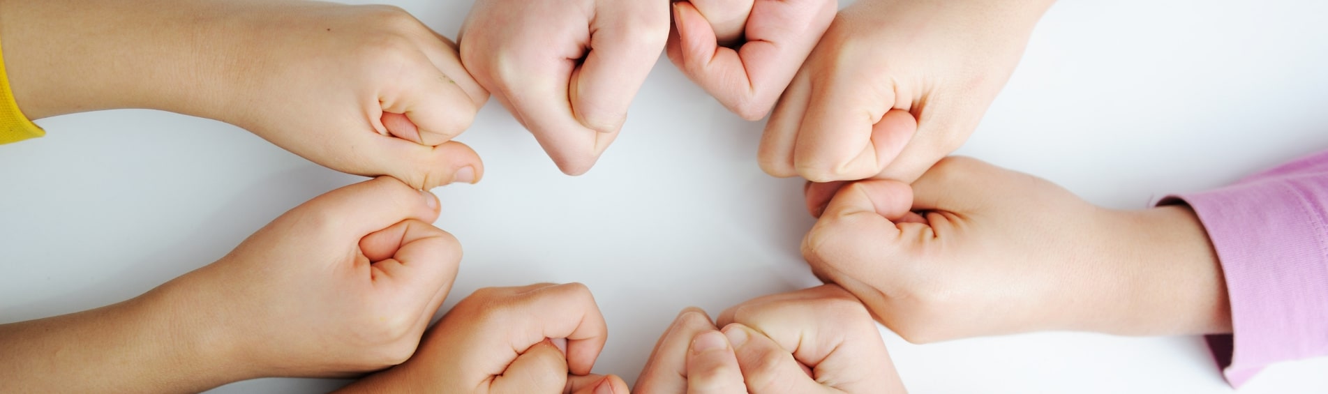 Kids hands creating a circle